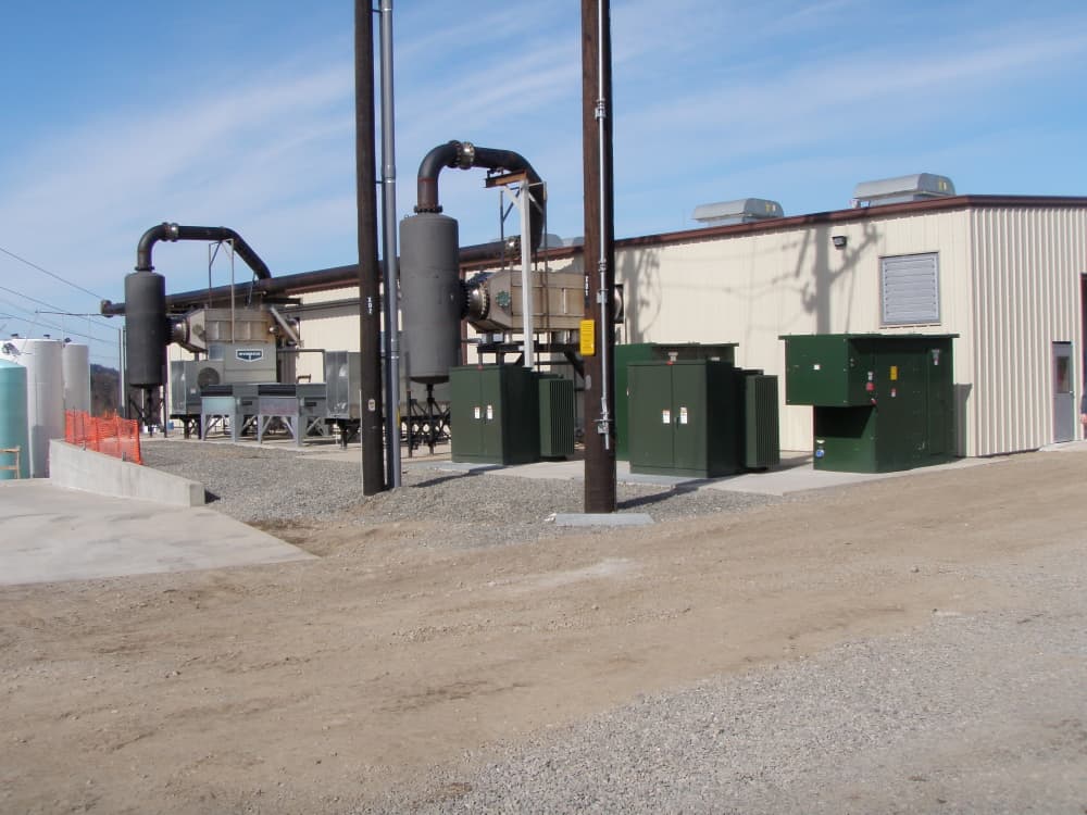 Landfill-gas-to-energy facility exterior with pad-mounted transformers and gas-processing equipment wired by H&M Electric